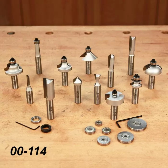 Router bit set with bearings and tools on a wooden workbench, woodworking tool kit 00-114.