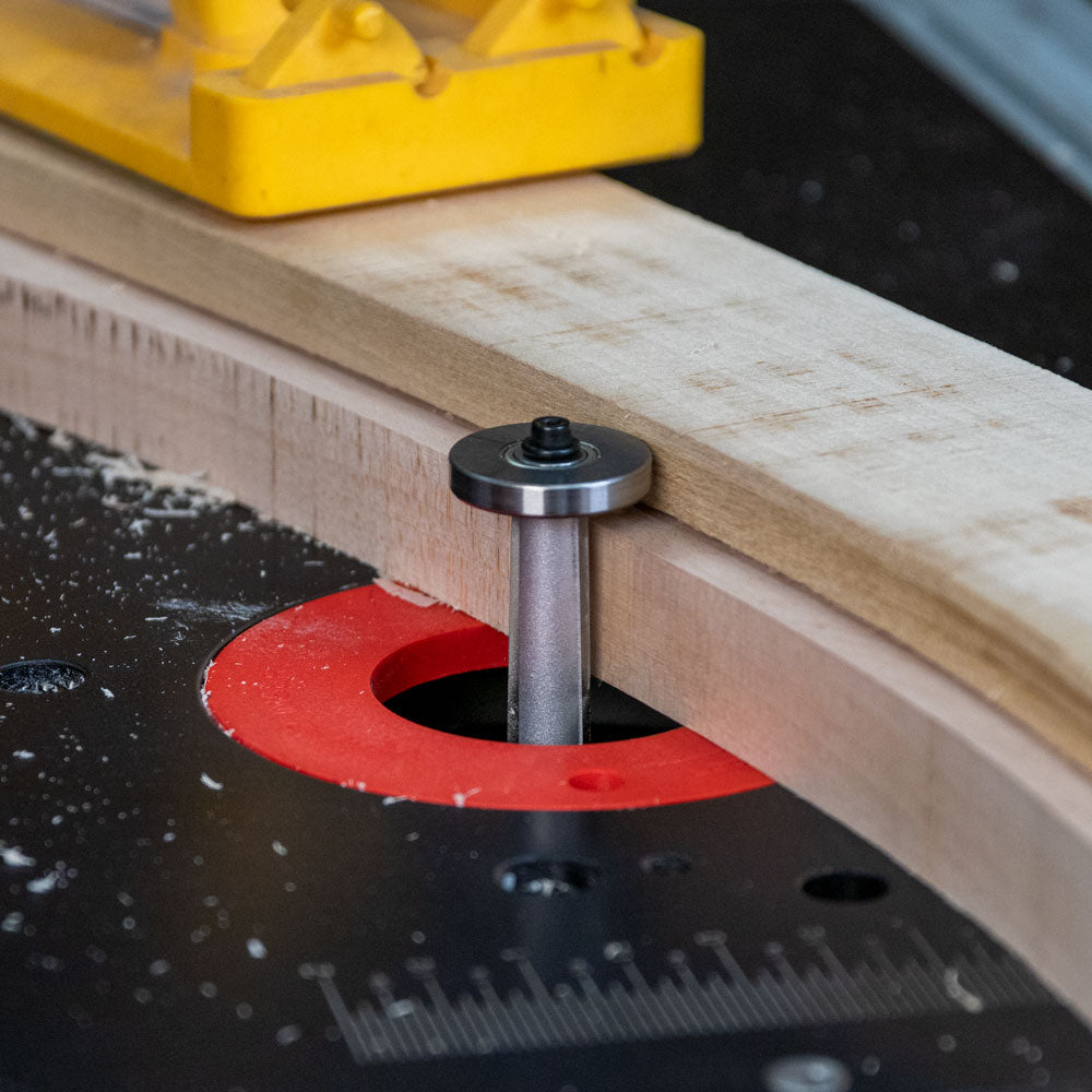Straight router bit with bearing trimming curved wood on router table