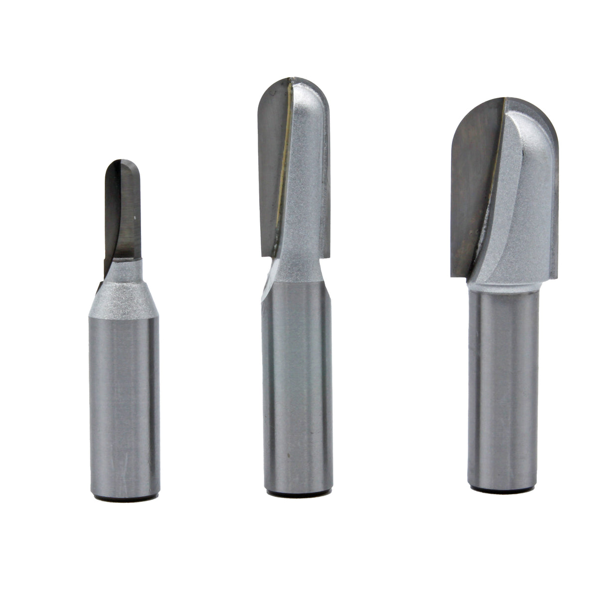 Set of three carbide-tipped router bits for woodworking, isolated on white background