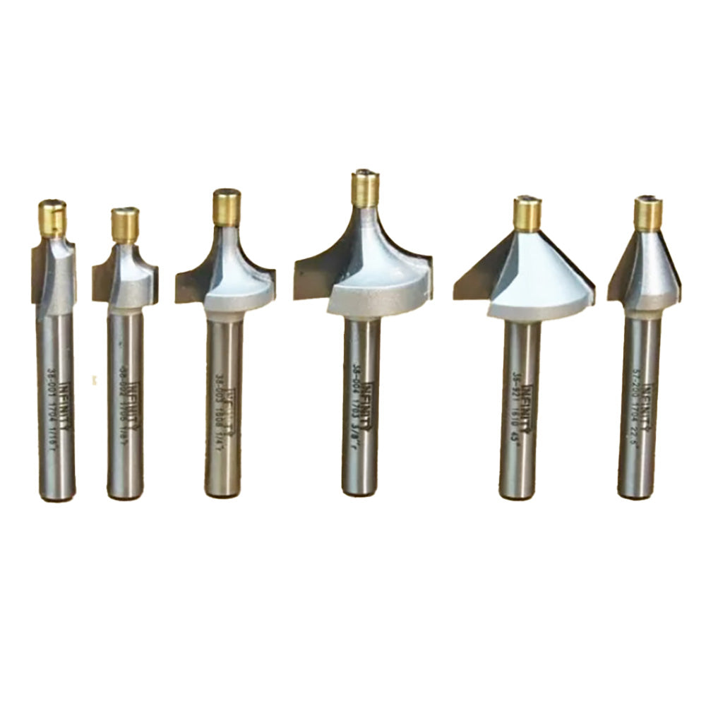 Set of six carbide-tipped woodworking router bits with various profiles on white background.
