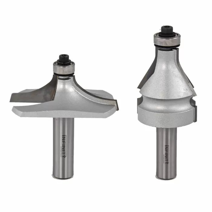 Two silver woodworking router bits with bearings on a white background