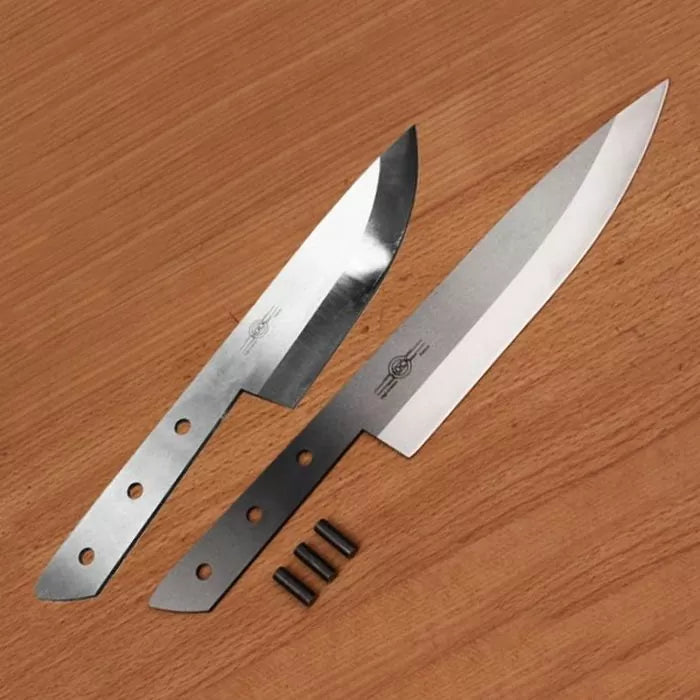 Two stainless steel knife blanks and three metal pins on a wooden surface, woodworking tools
