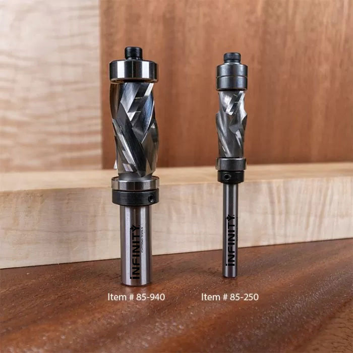 Two carbide spiral router bits for woodworking on a wooden surface, labeled item 85-940 and 85-250.