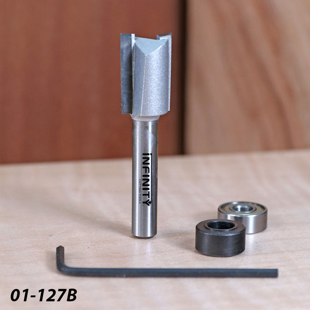 Woodworking router bit set with bearings, hex key, and straight carbide cutting tool on a table