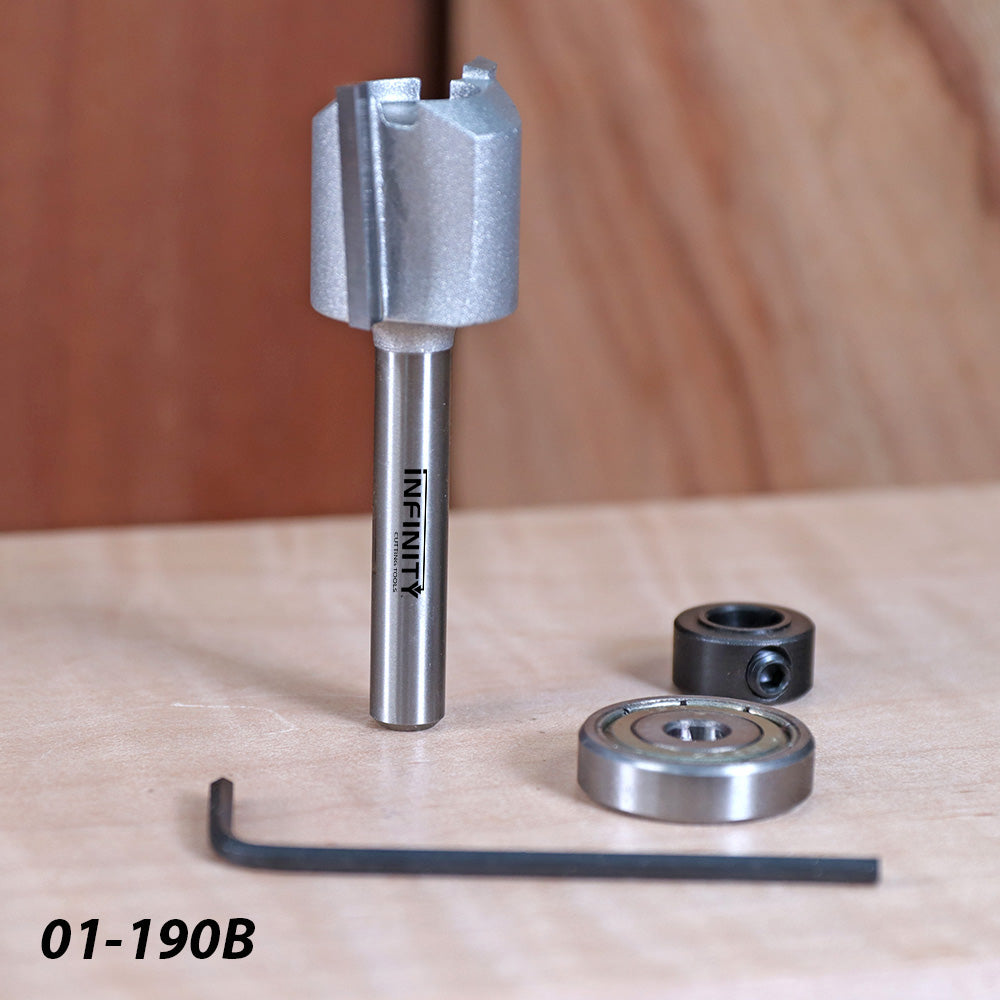 Router bit with Infinity label, two bearings, and hex key on a wooden surface
