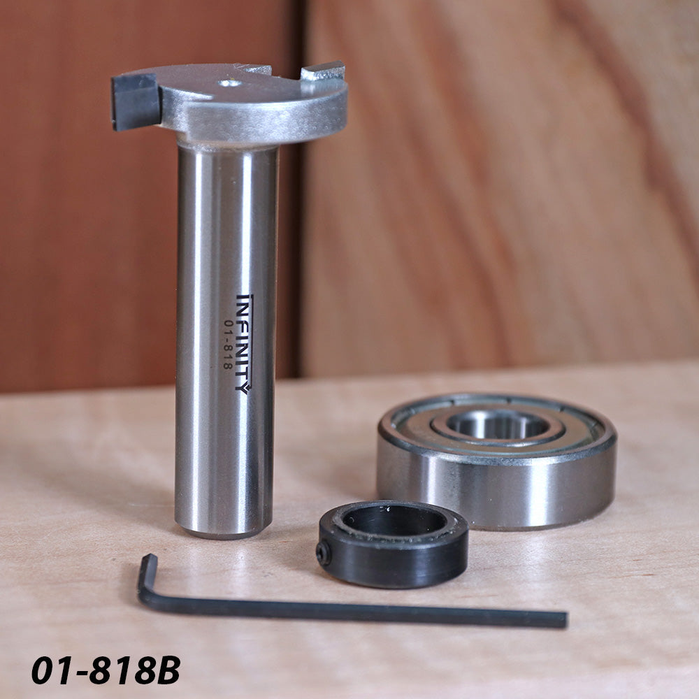 Router table edge trimming bit set with bearing, hex key, and ring on wood surface