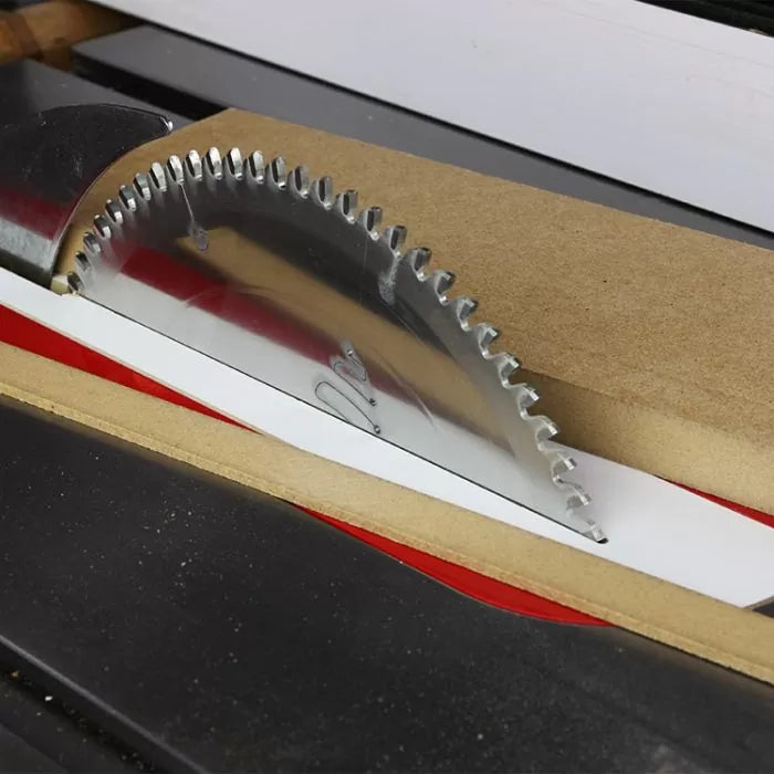 Table saw blade cutting through wood, precision woodworking tool in action