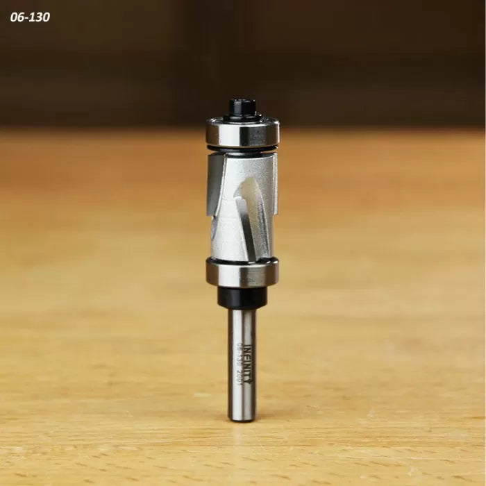 Carbide spiral flush trim router bit with dual bearings on a wood surface