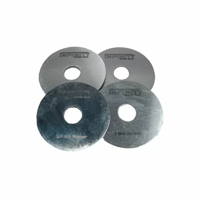 Set of four metal saw blade spacers for woodworking, labeled with thickness sizes.