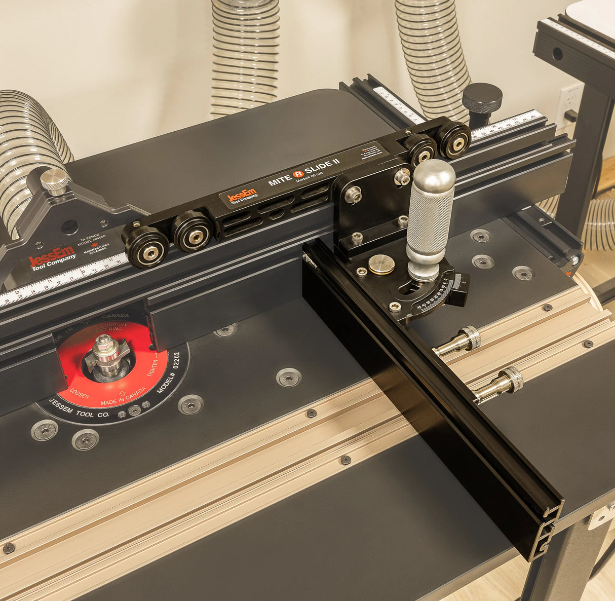 Router table with precision fence, miter gauge, and dust collection for woodworking