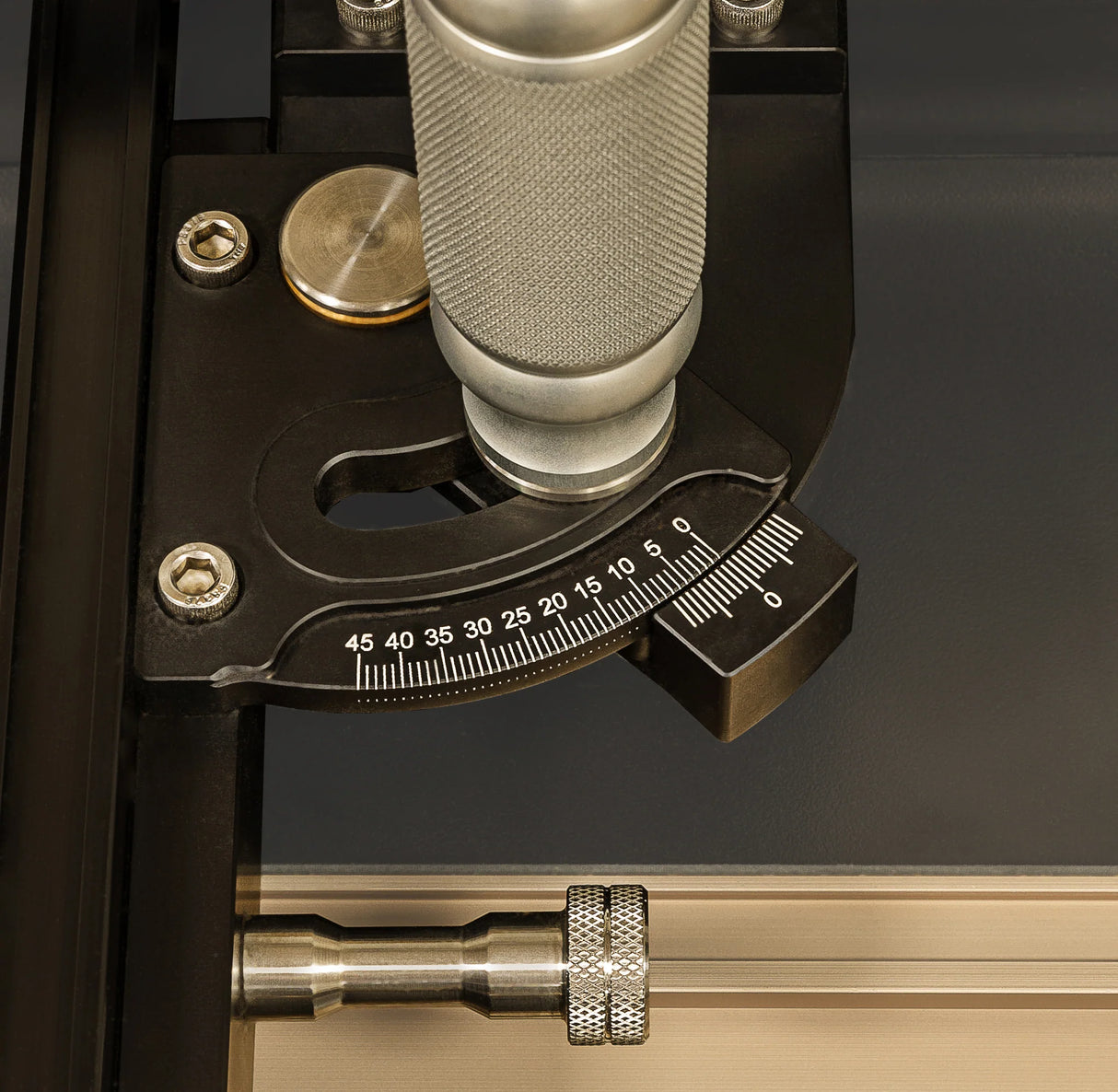 Precision woodworking tool with angle adjustment dial and metal handle, close-up