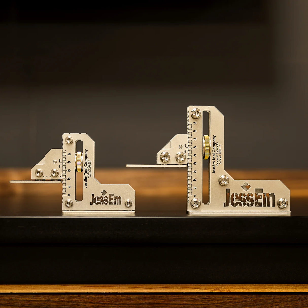 Precision aluminum woodworking squares with measurement markings on a workbench