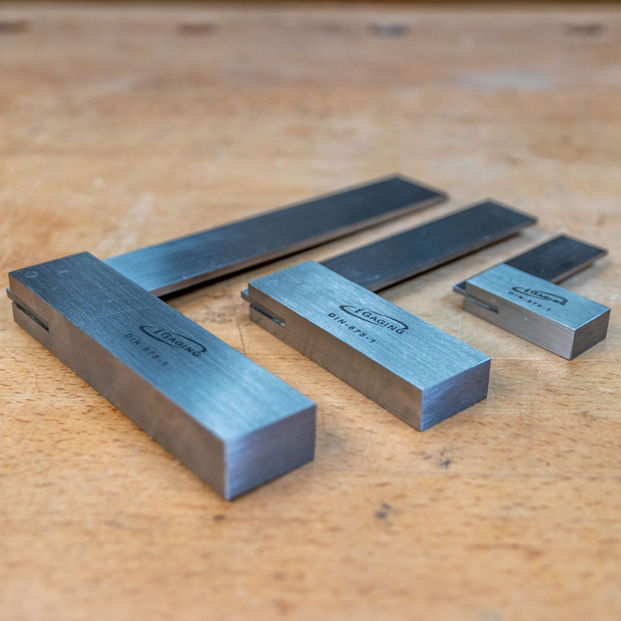 Set of premium woodworking square tools on a wooden workbench
