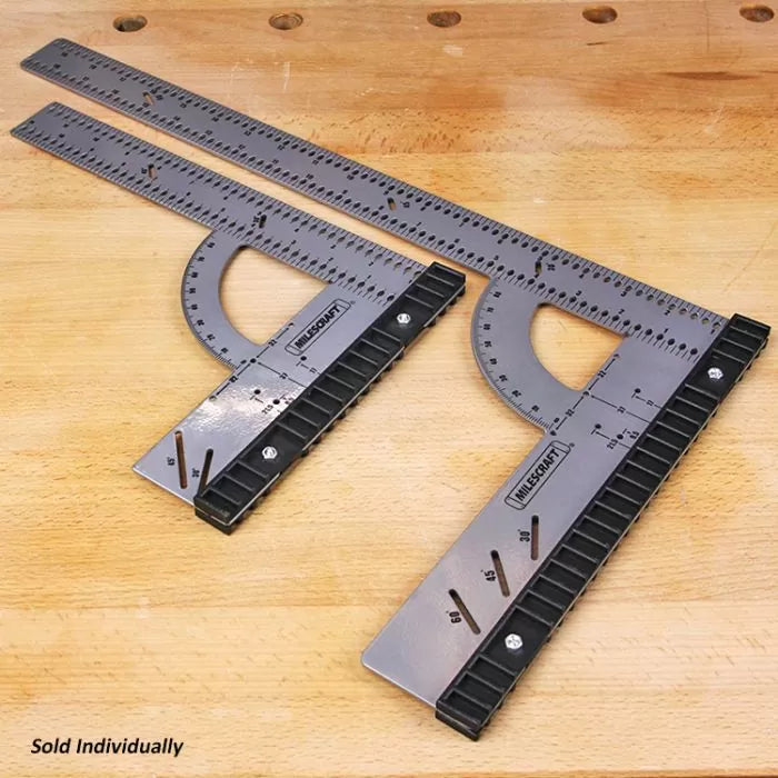 Two metal woodworking squares with protractor guides on wooden workbench