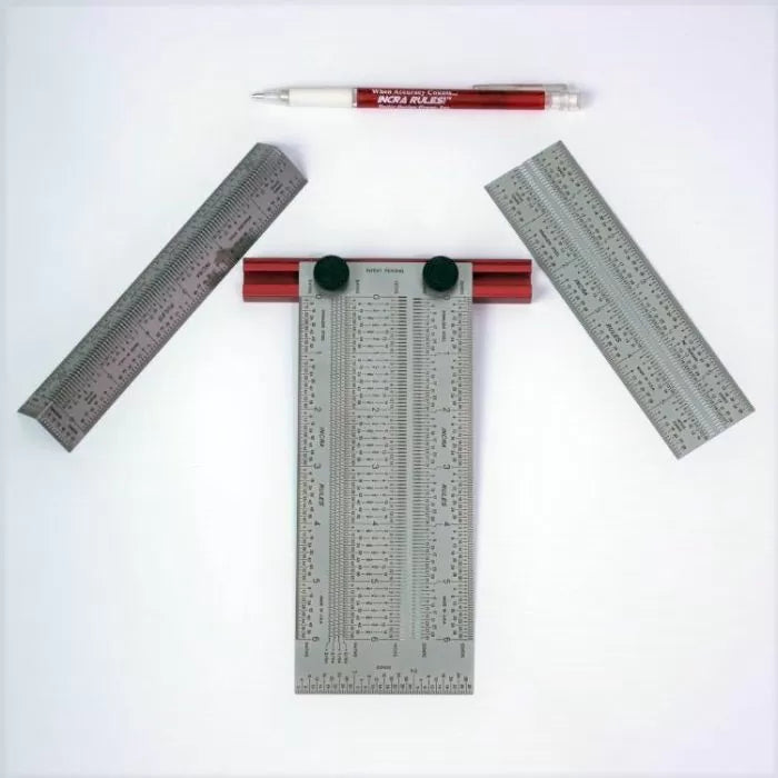 Precision woodworking ruler set with pen, metal measuring tools on white background.