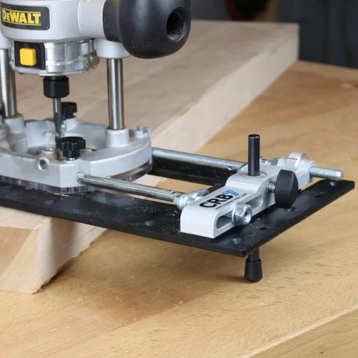 Wood router with edge guide attachment on workbench for precision woodworking