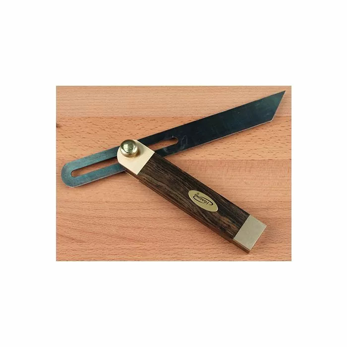 Woodworking sliding bevel gauge with wood handle and brass accents on a wood surface