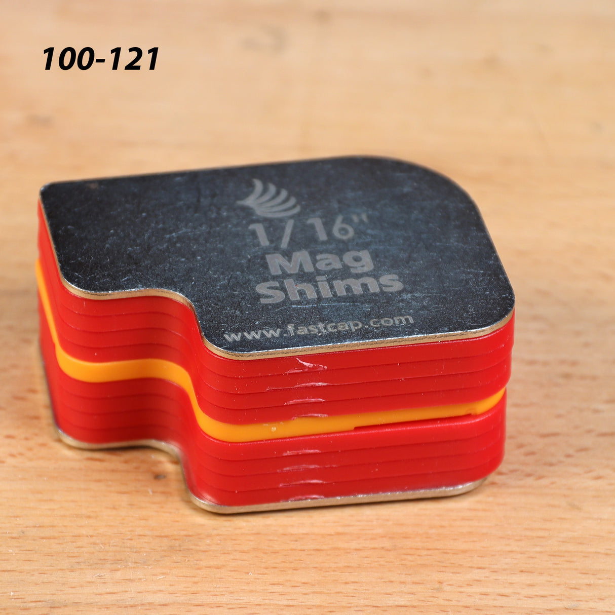 1/16 inch mag shims stack for woodworking on a workbench surface