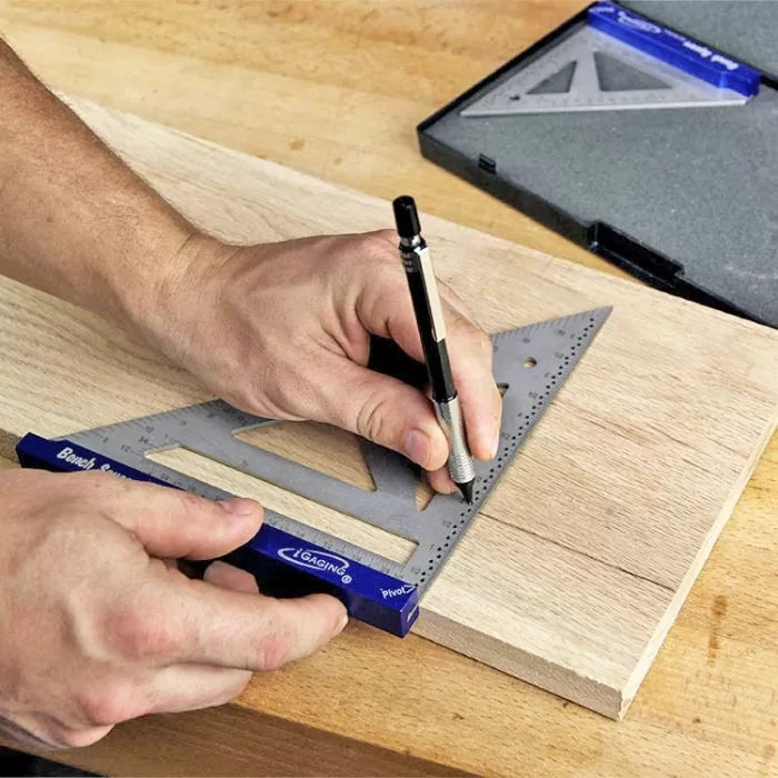 Marking wood with a precision carpenter square and pencil on a workbench