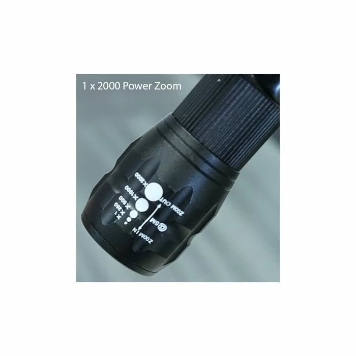 Close-up of black 2000 power zoom dial on a tool, showing magnification settings.