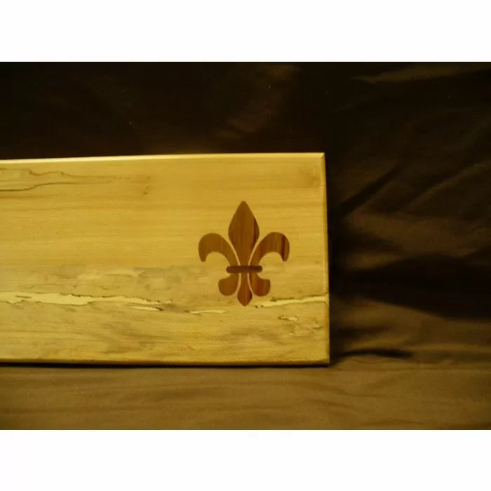 Wooden board with fleur-de-lis inlay design for woodworking projects