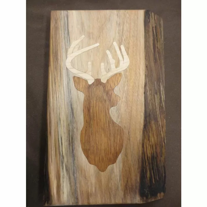 Wood inlay deer silhouette with antlers on rustic wooden board, woodworking project