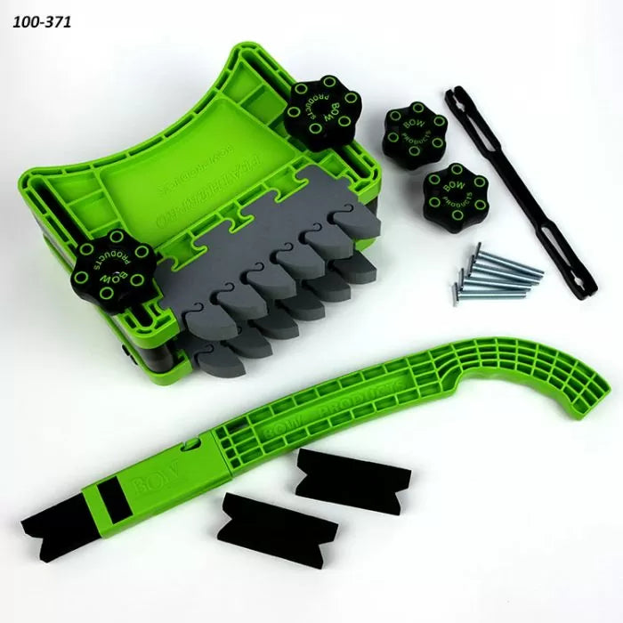 Green woodworking featherboard set with knobs, screws, and push stick for table saw safety.