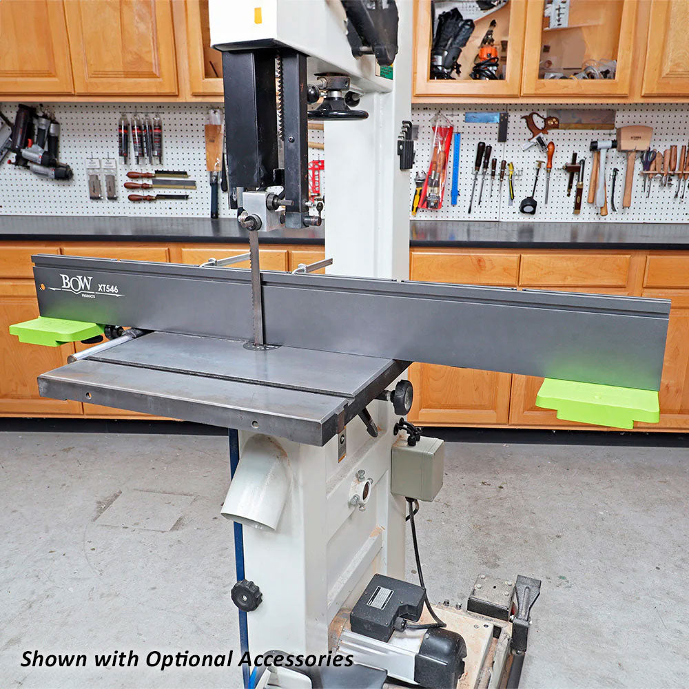 Band saw with adjustable fence and safety accessories in woodworking shop