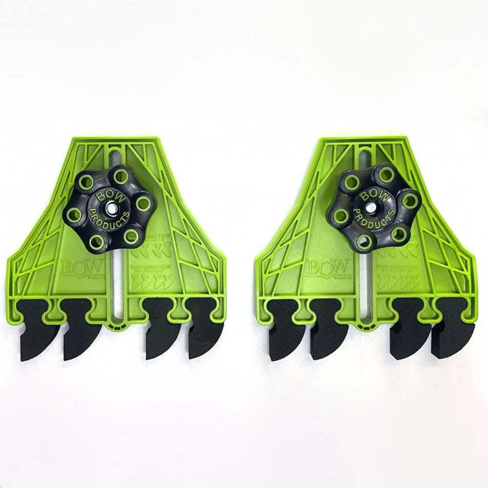 Pair of green featherboards for woodworking, featuring black adjustment knobs and fingers