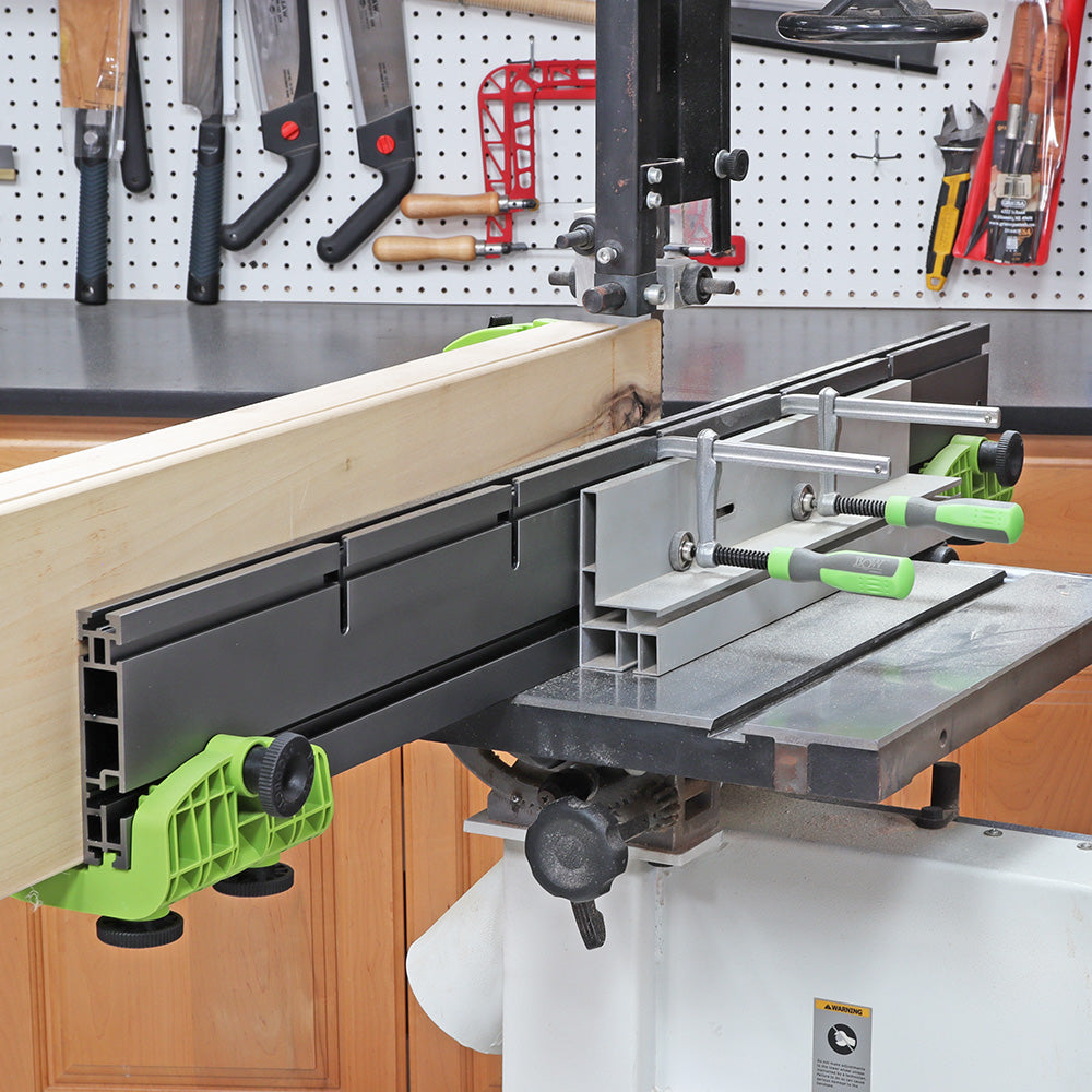 Bandsaw fence system with clamps holding wood for precise woodworking cuts