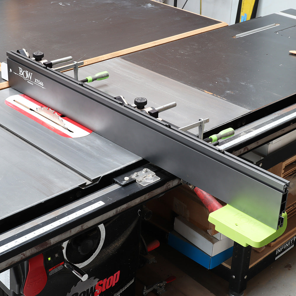 Table saw equipped with BOW XT546 fence system and saw blade in workshop setting