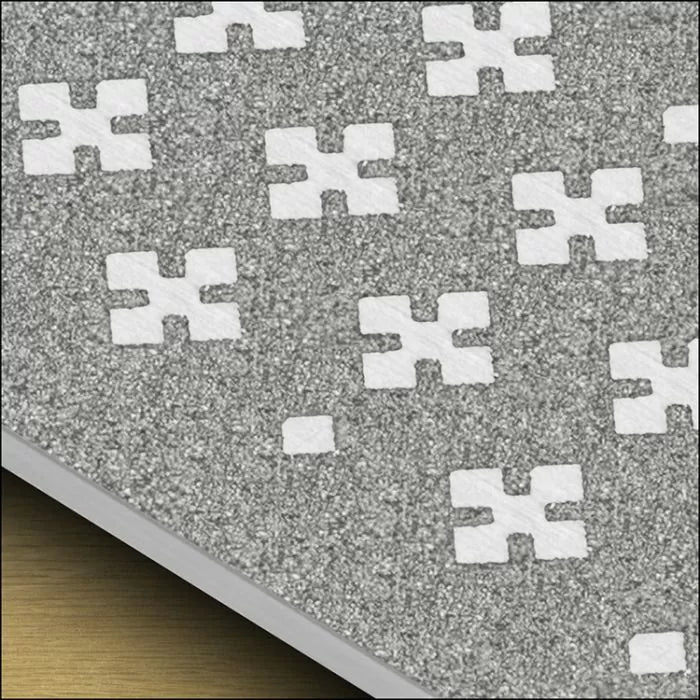 Close-up of grey abrasive sandpaper with white cross-shaped grit pattern for woodworking