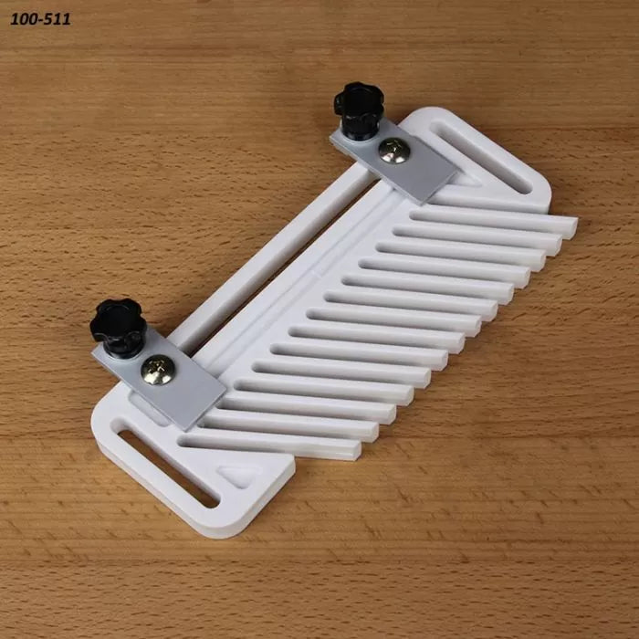 Plastic woodworking featherboard for router tables, on a wooden surface