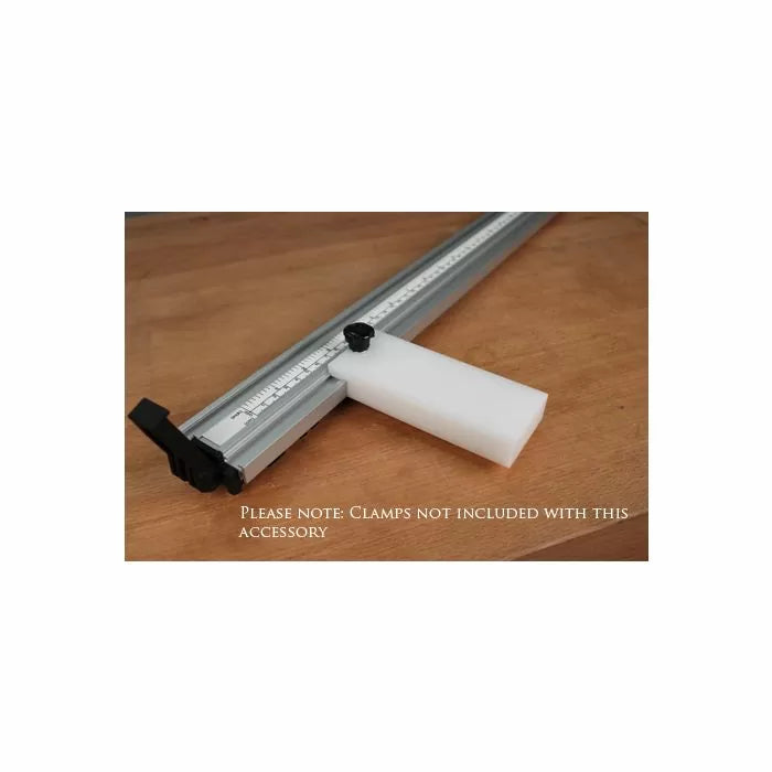 Aluminum woodworking guide rail with adjustable stop block on wooden surface