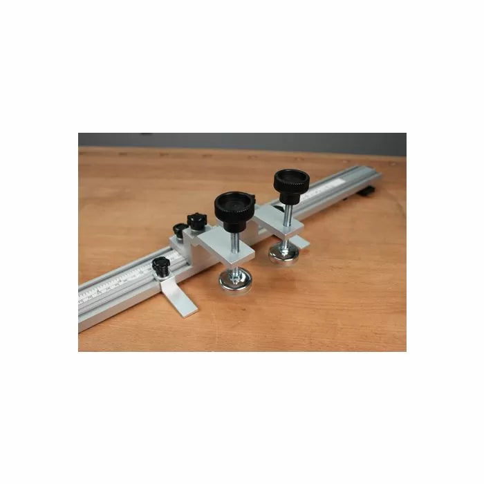 Aluminum router table fence stop with knobs and measuring scale on a wood surface