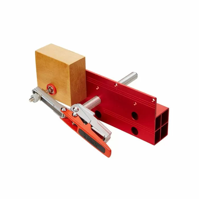 Woodworking toggle clamp jig with red aluminum fence and wooden block