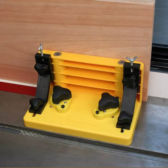 Magnetic featherboard woodworking jig securing wood on table saw