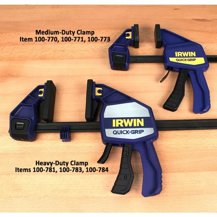 Medium-duty and heavy-duty IRWIN Quick-Grip woodworking clamps on a wooden surface