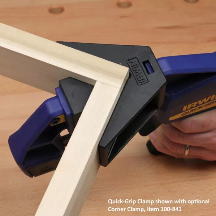 Quick-Grip clamp securing two wooden boards at a right angle for woodworking projects
