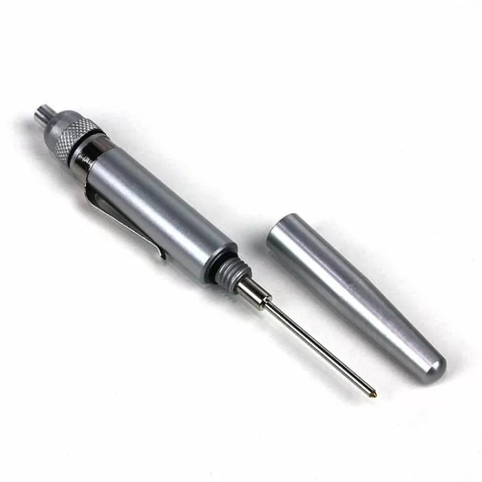Aluminum automatic center punch tool with knurled grip and removable cap on white background