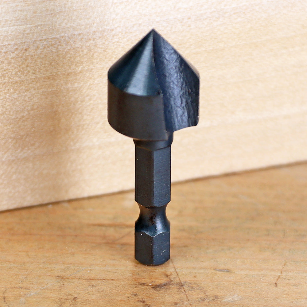 Black carbide countersink drill bit for woodworking on a wooden surface