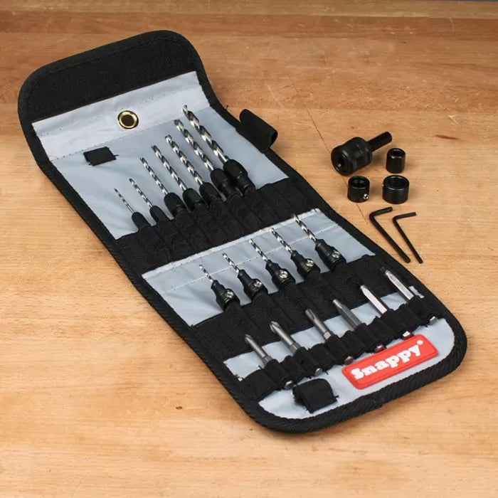 Woodworking drill and driver bit set in a foldable case on a workbench