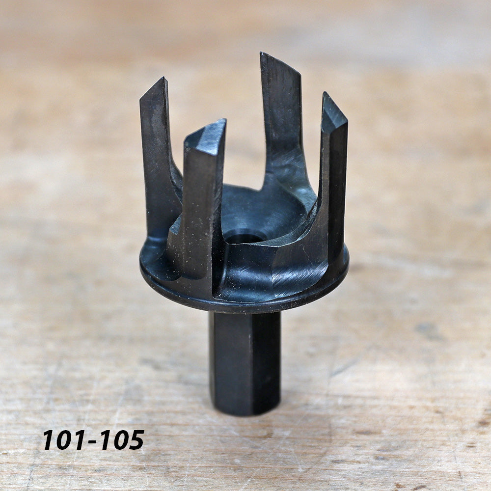 Six-blade woodworking tenon cutter on workbench, used for joinery and precision cutting