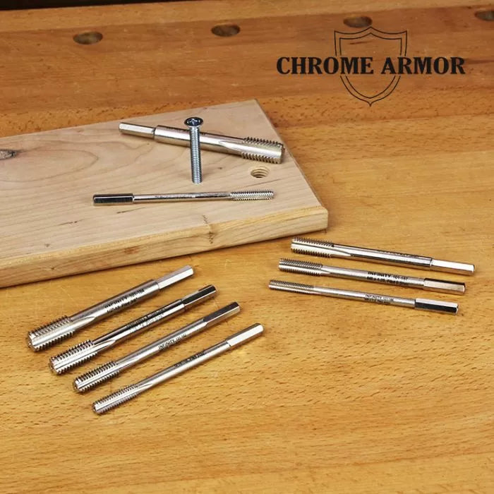 Chrome Armor threaded taps displayed on a wooden workbench with woodblock for woodworking.
