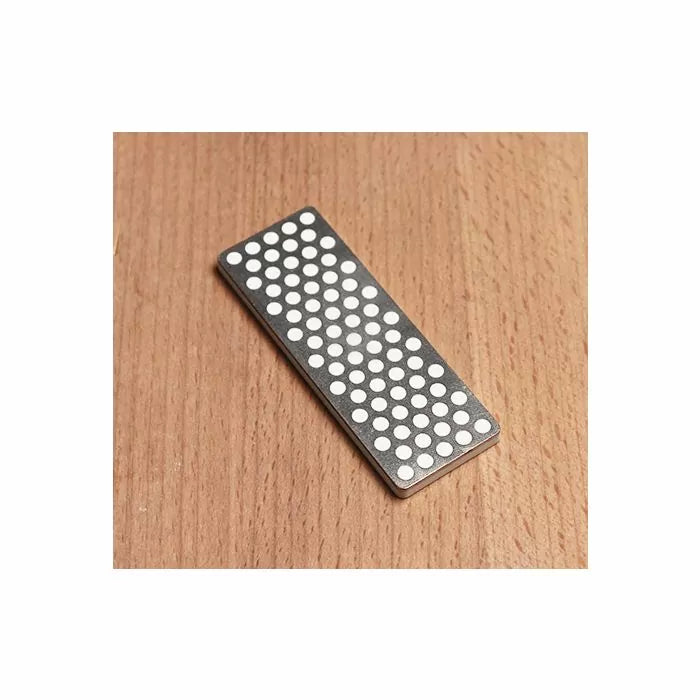 Diamond sharpening stone for woodworking tools on wooden surface