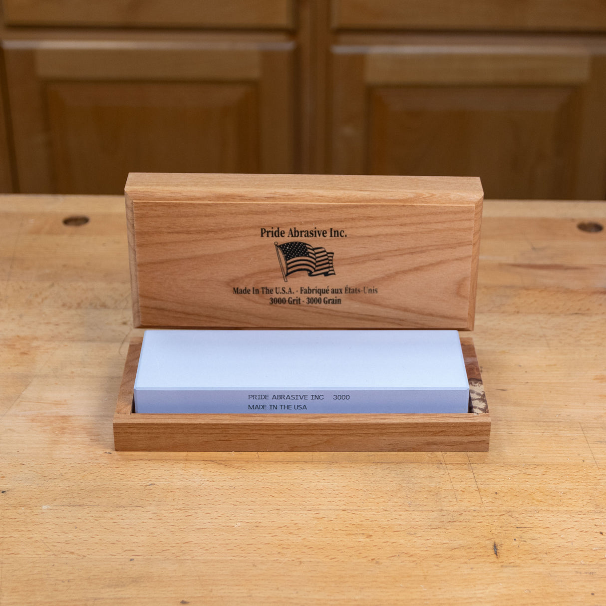 3000 grit waterstone sharpening stone in wooden box on workbench