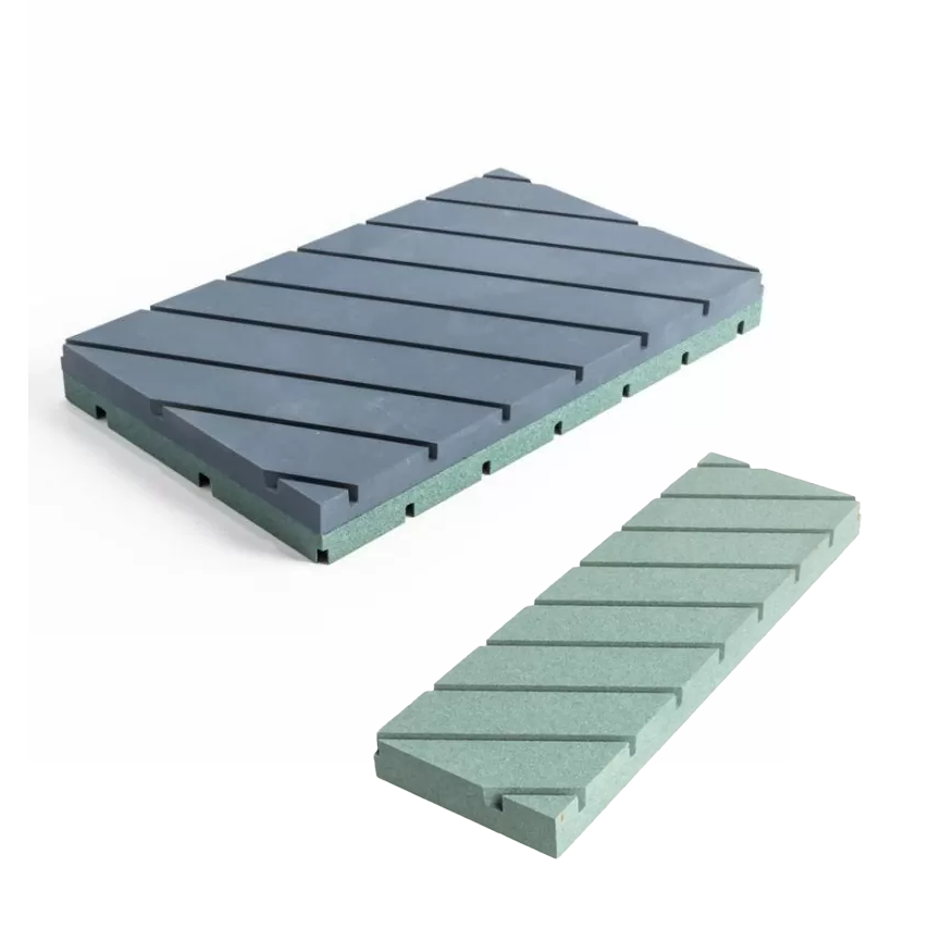 Two CNC router spoilboards with diagonal grooves for woodworking tables