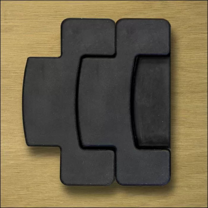 Black cope and stick router bit profile sample on a wood background