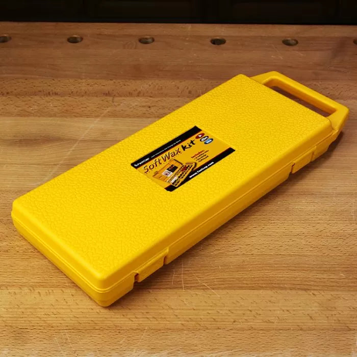 Yellow SoftWax Kit case for woodworking on a wooden workbench