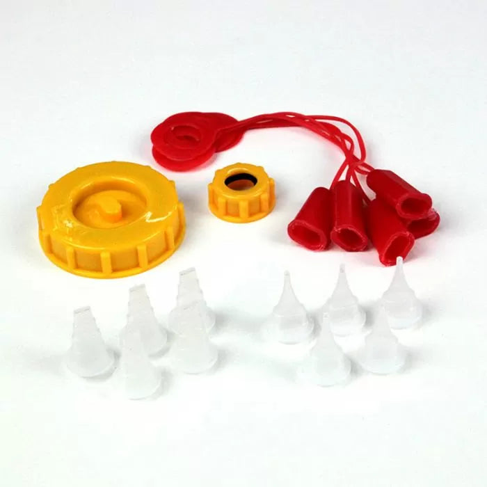 Wood glue dispenser kit parts including yellow caps, red covers, and clear bottle tips